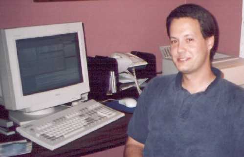 Picture of Ernest Morgan at his desk.